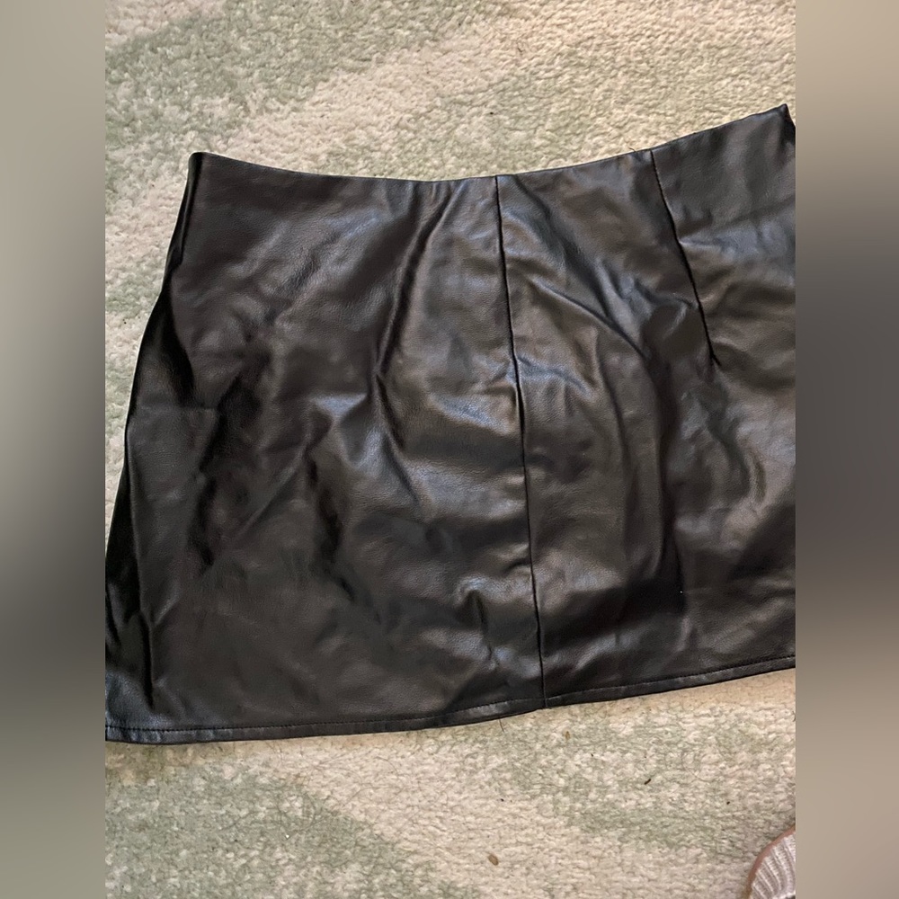 Mini black leather skirt